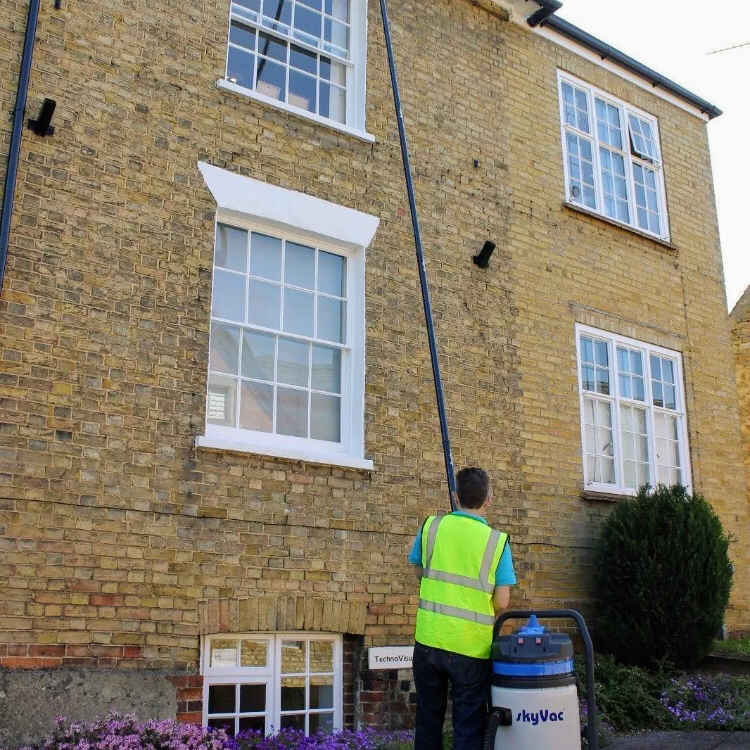 Reach-and-wash window cleaning on a tall property